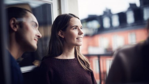 Smiling woman with friends looking away